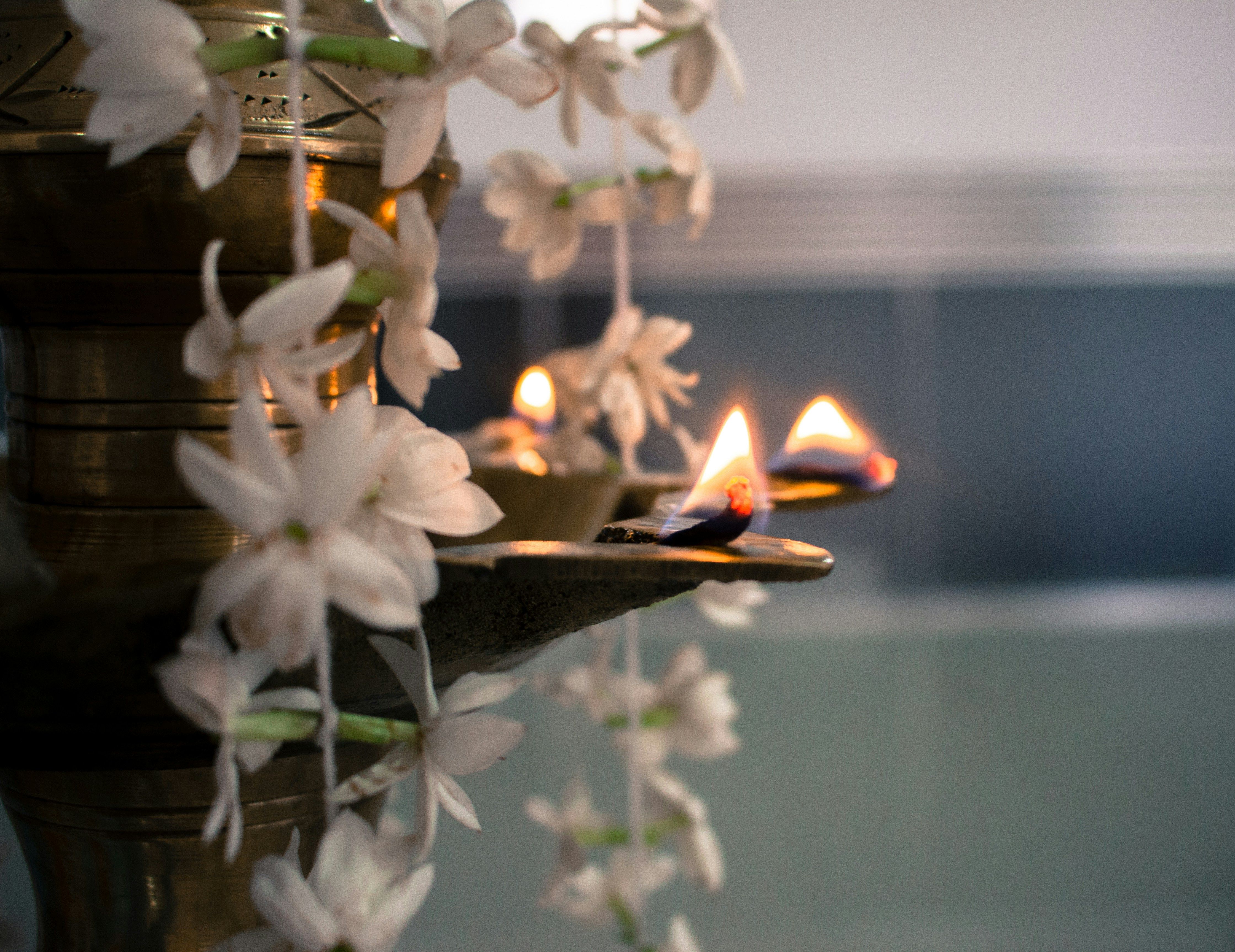 a close up of a candle and some flowers