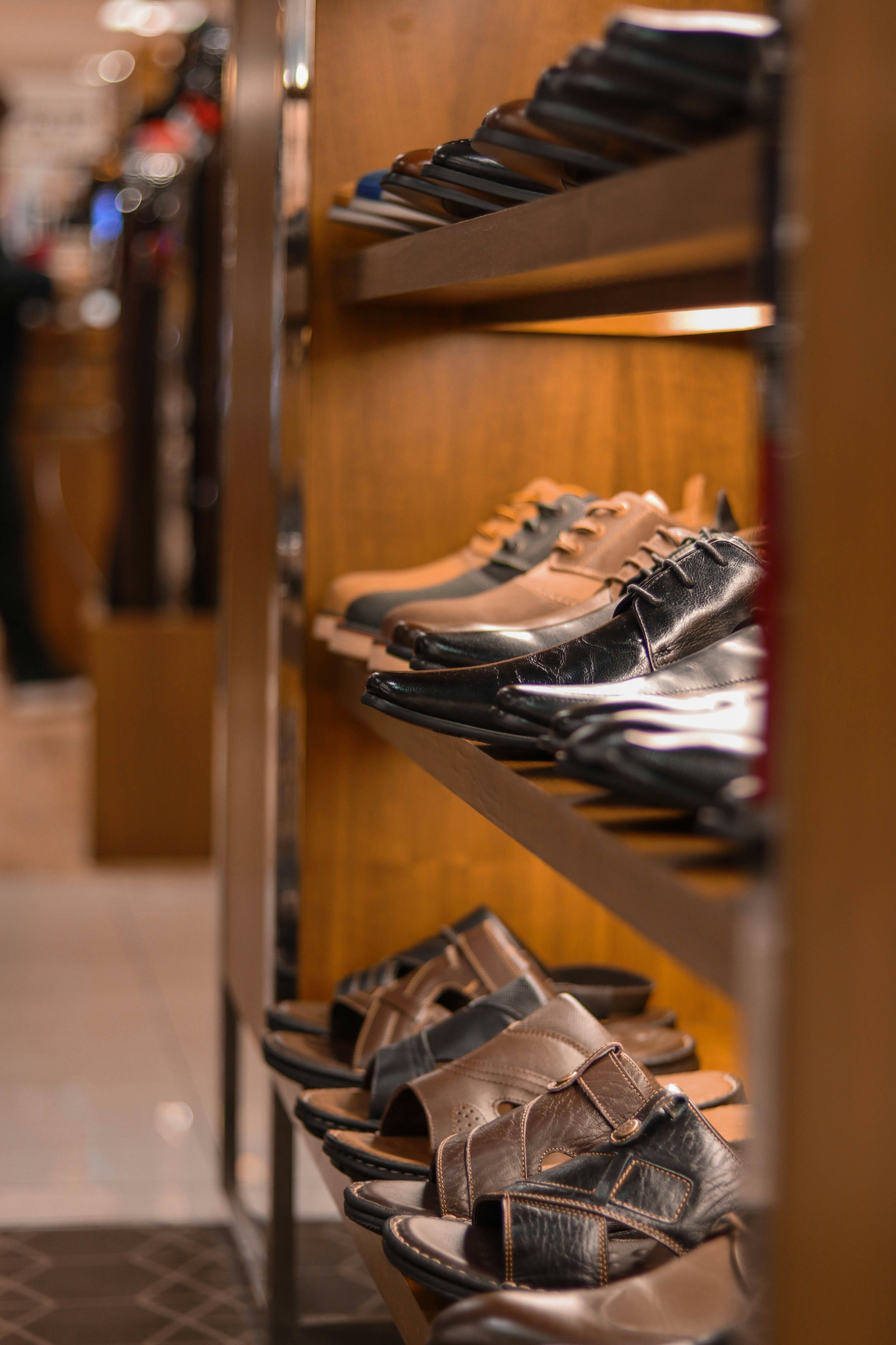 a bunch of shoes that are on a shelf