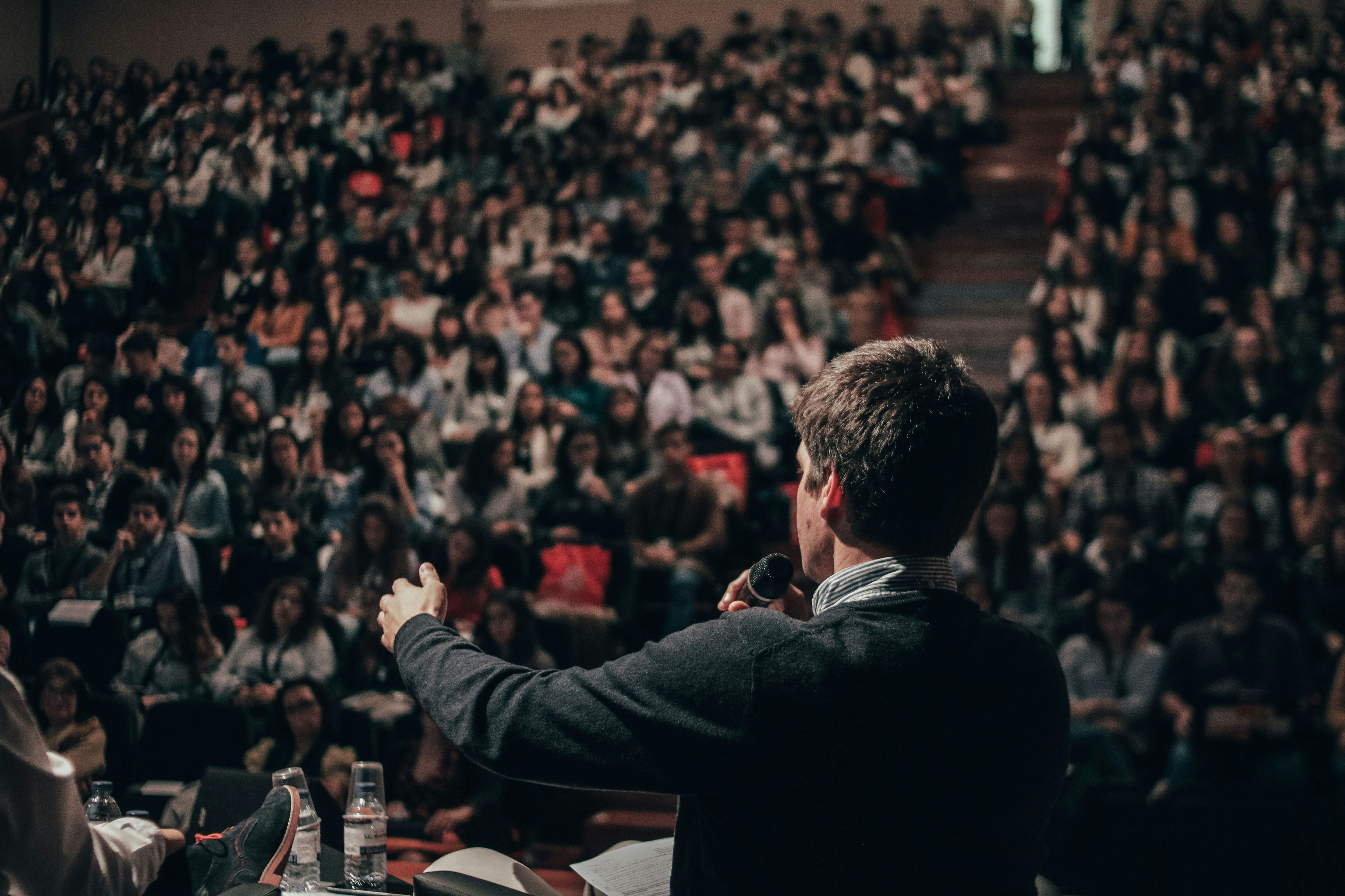 a man standing in front of a crowd of people